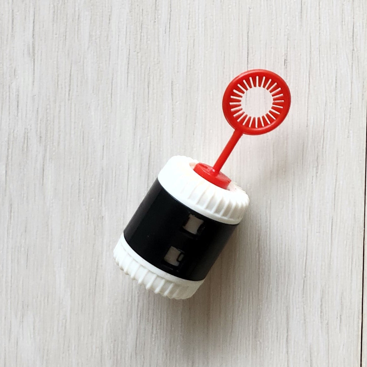 Small row counter with knitting needle attachment