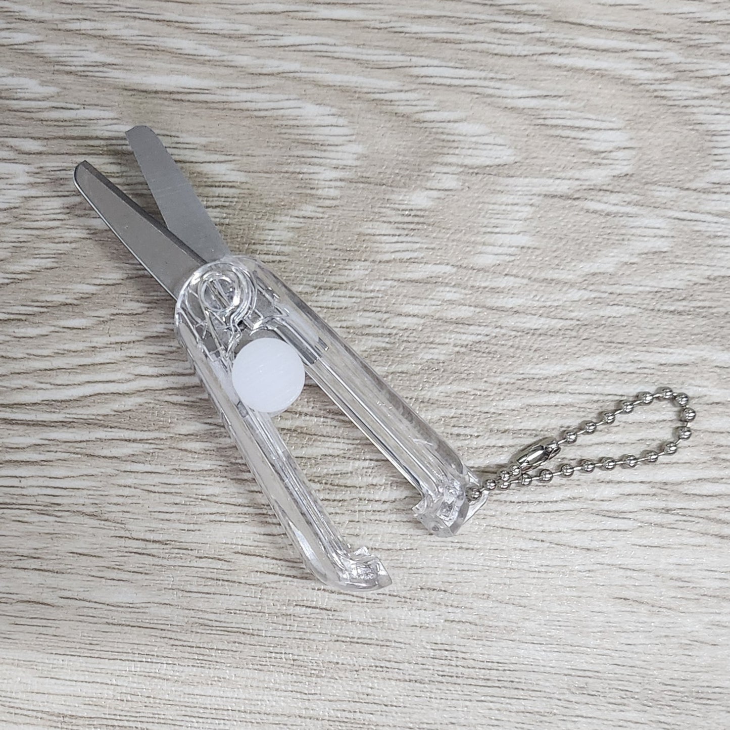 Clear foldable retractable scissors