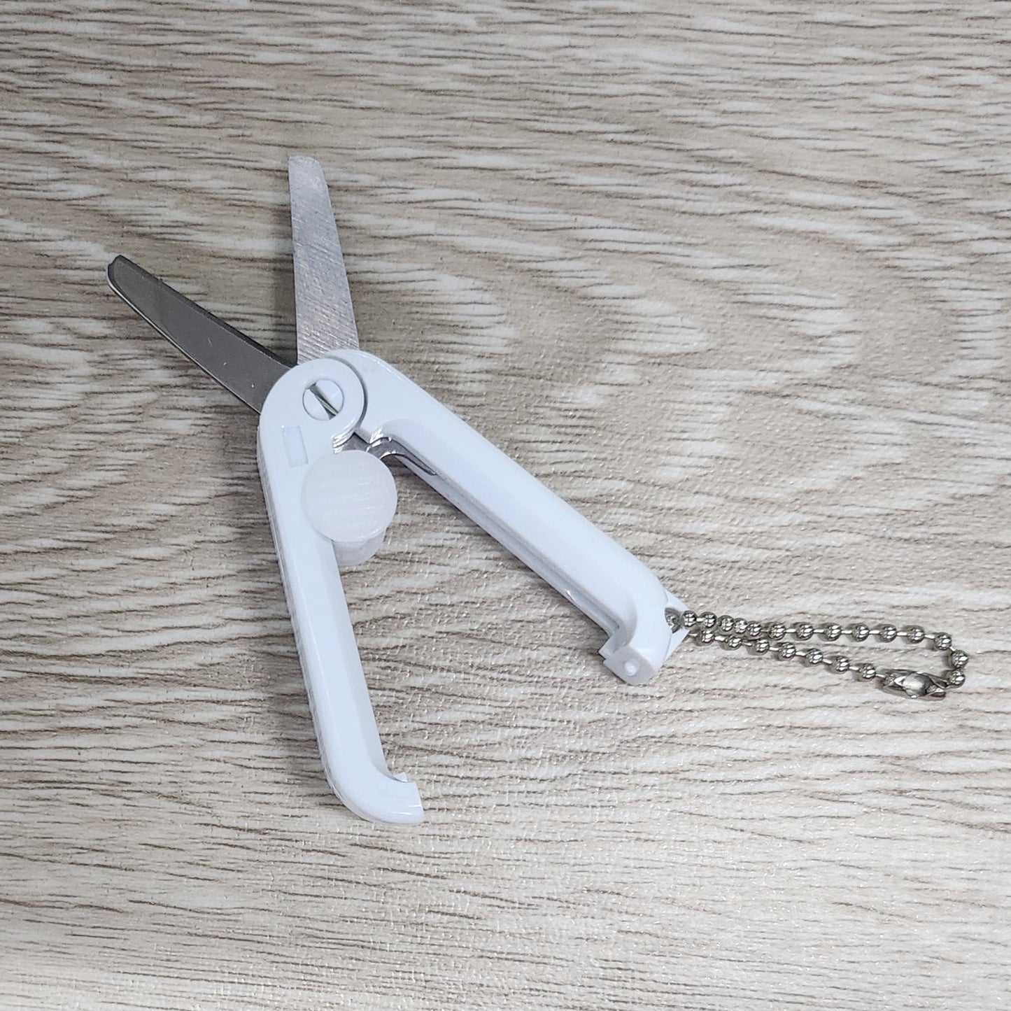 White foldable retractable scissors