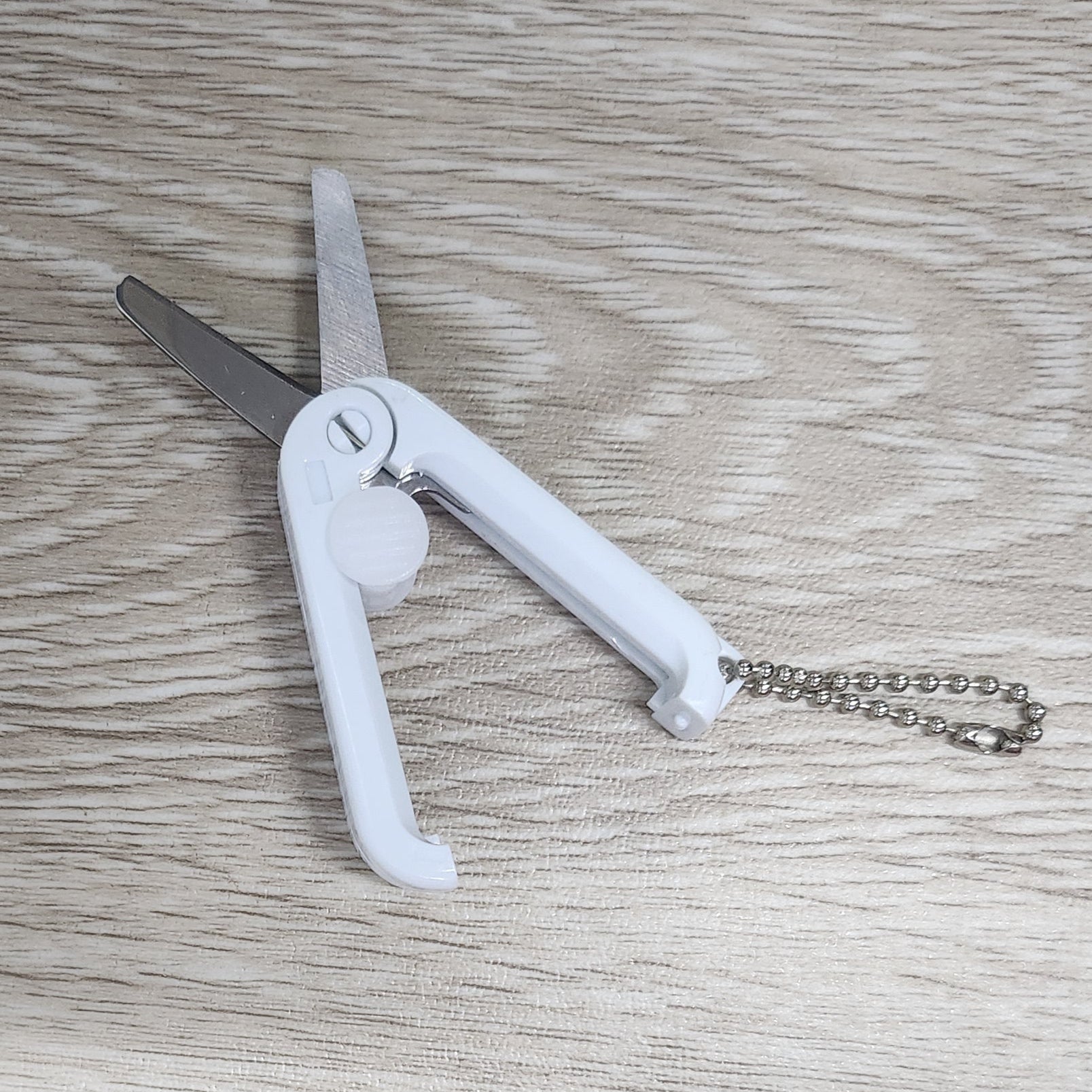 White foldable retractable scissors