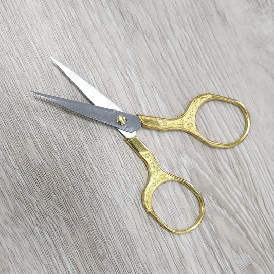 Larger embroidery sized antique style gold scissors.