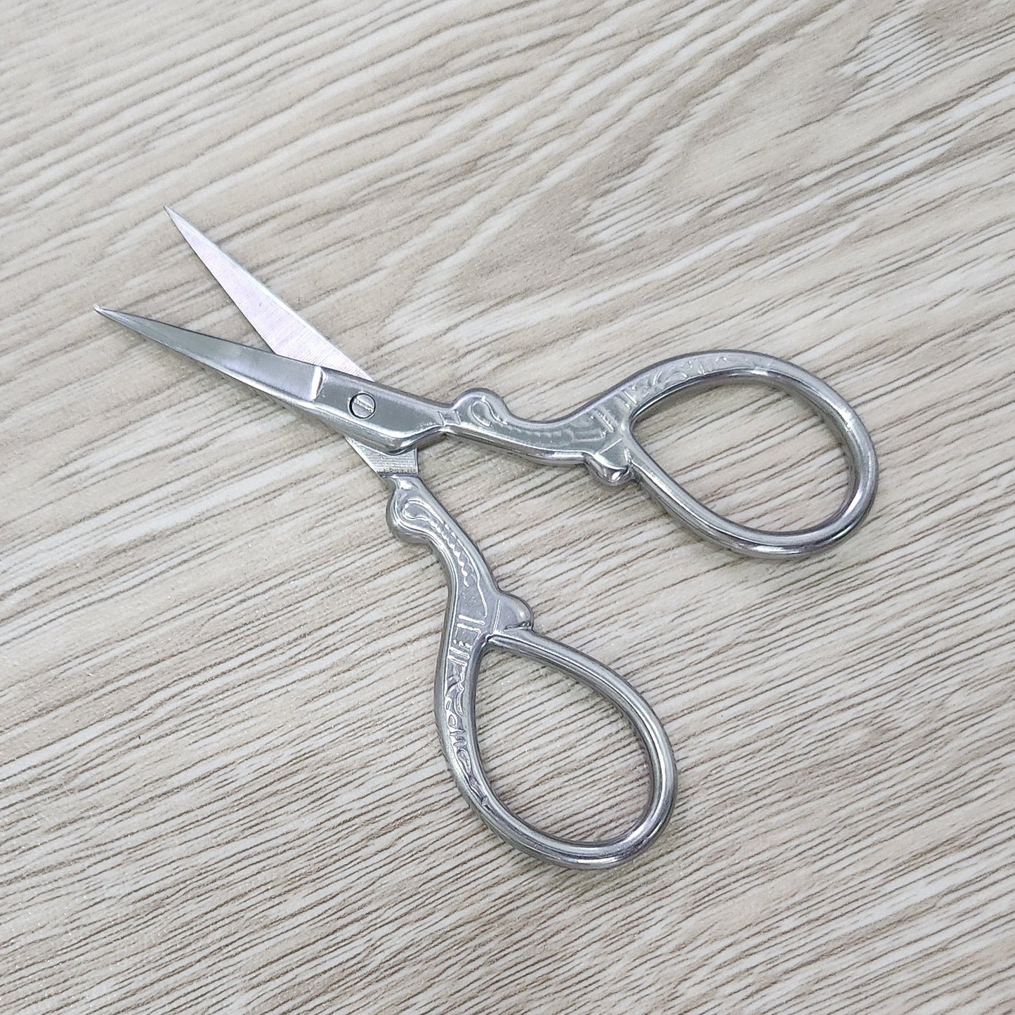 Ombre stainless steel craft embroidery scissors.