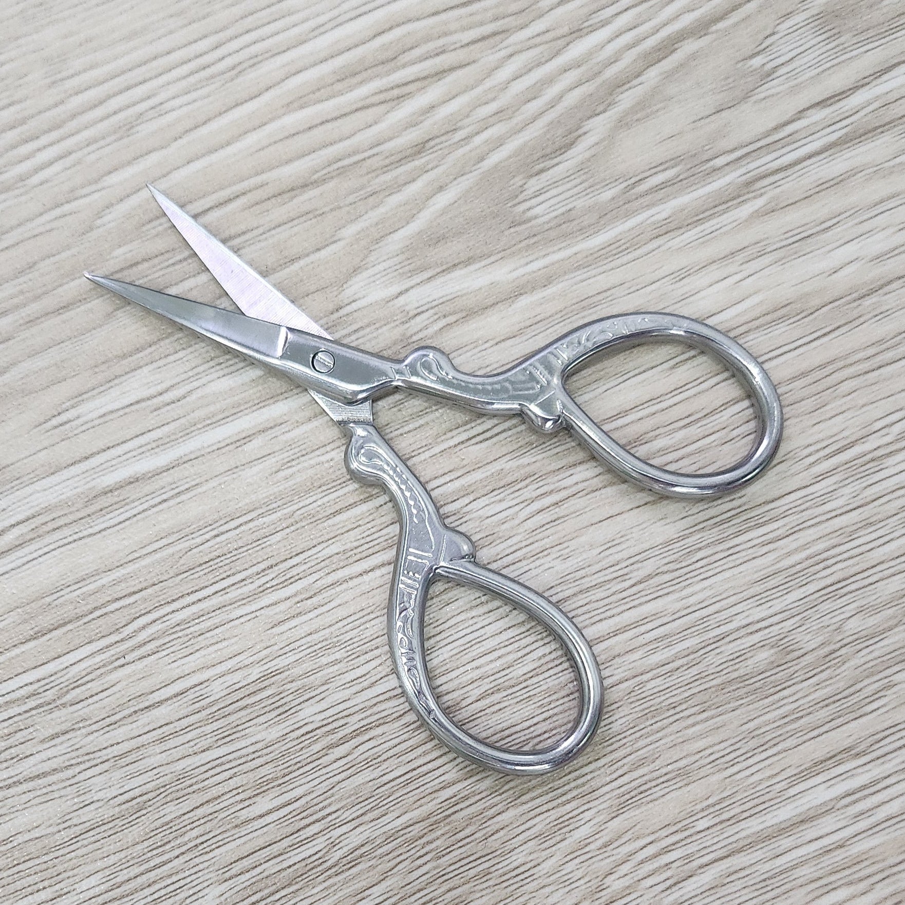 Ombre stainless steel craft embroidery scissors.