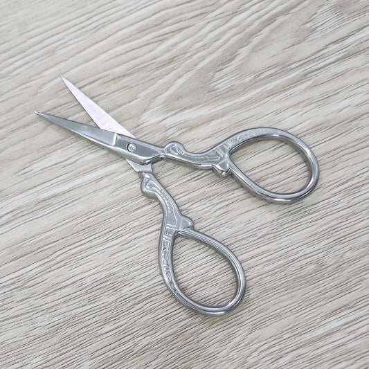 Ombre stainless steel craft embroidery scissors.