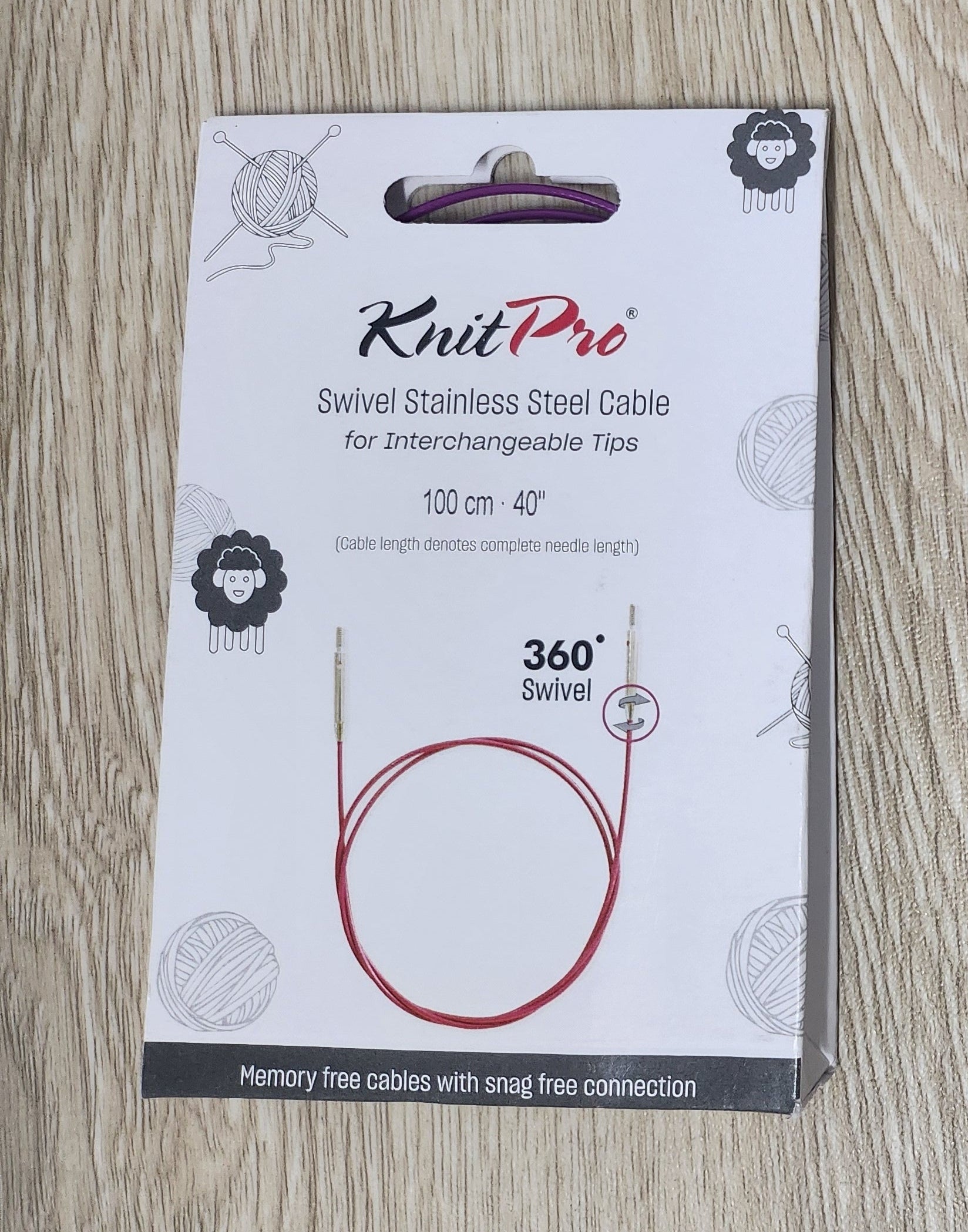KnitPro cable packaging on a wooden surface
