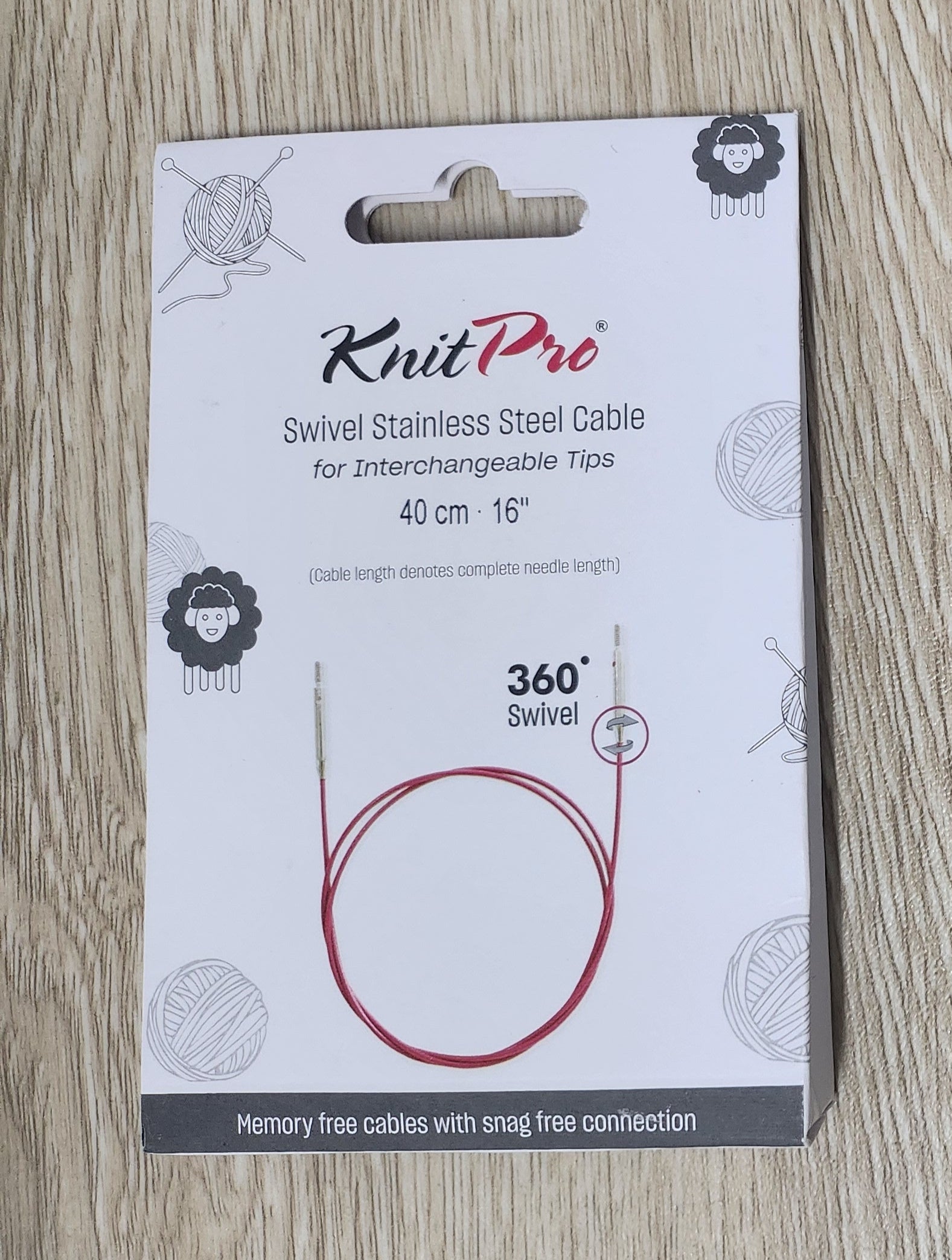 Knut Pro cable packaging on a wooden surface