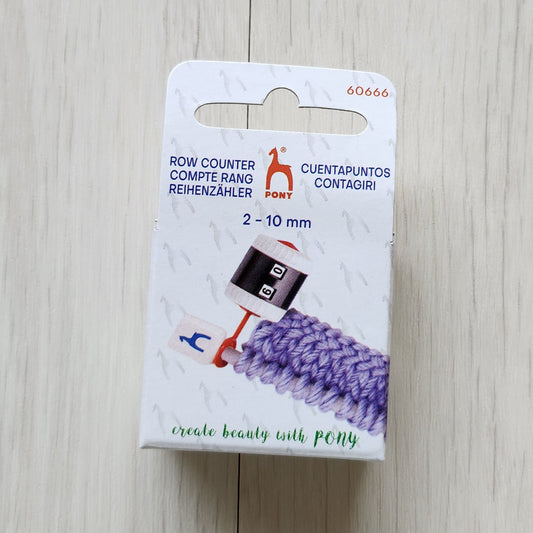 Small row counter with knitting needle attachment