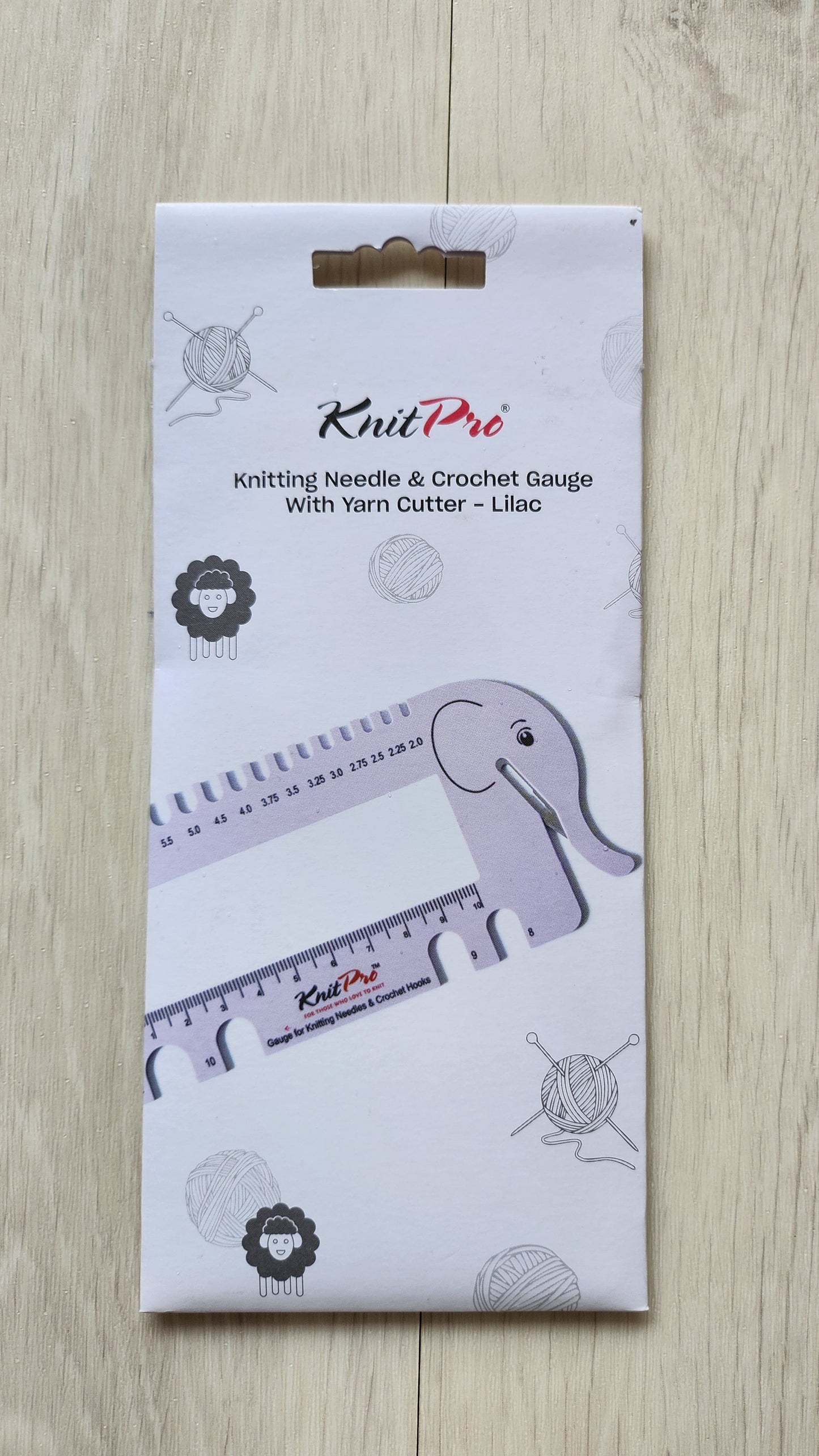 KnitPro knitting needle and cutter package on a wooden surface