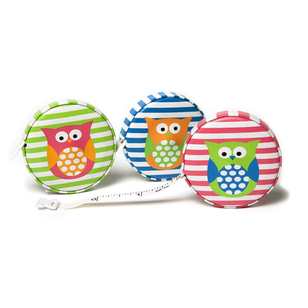 Three colorful retractable tape measures with owl designs on a white background
