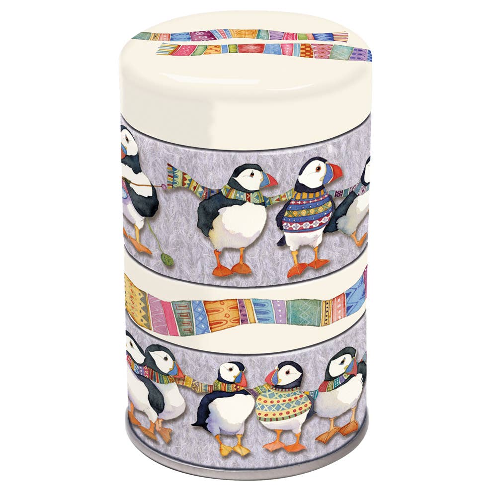Three-tiered cylindrical container with penguin design on a white background
