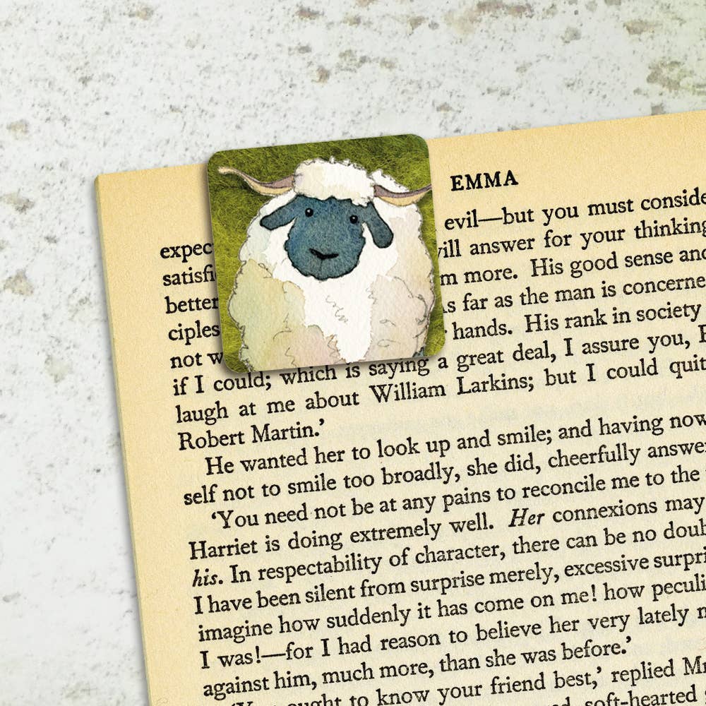 Sheep-shaped bookmark on a page of a book